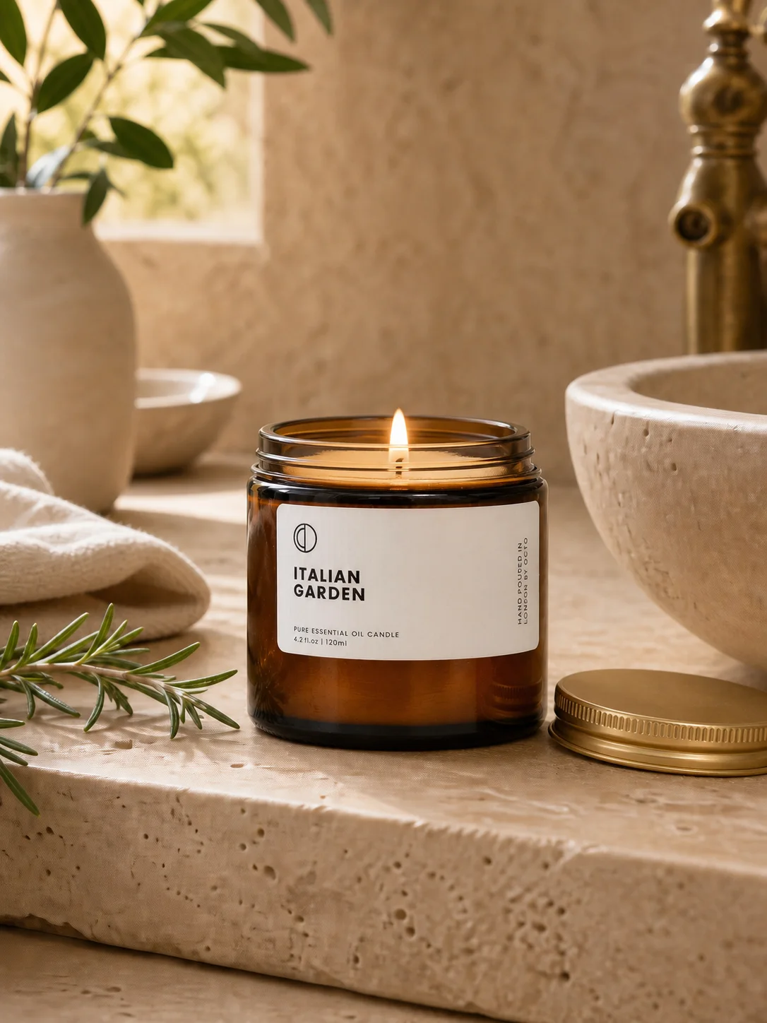 Lit Italian Garden candle staged in a Mediterranean bathroom ritual