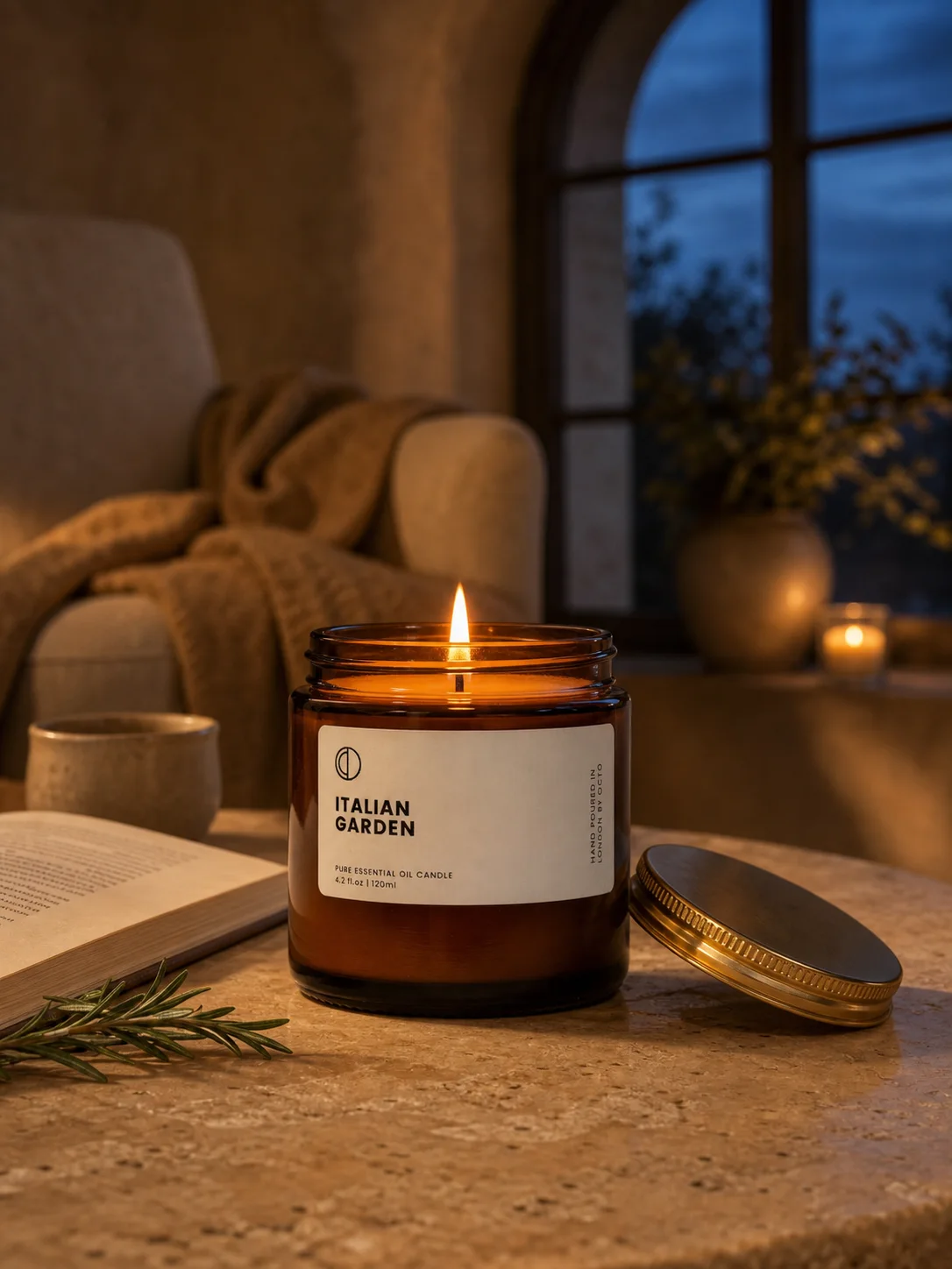 Italian Garden candle staged in a warm evening reading nook