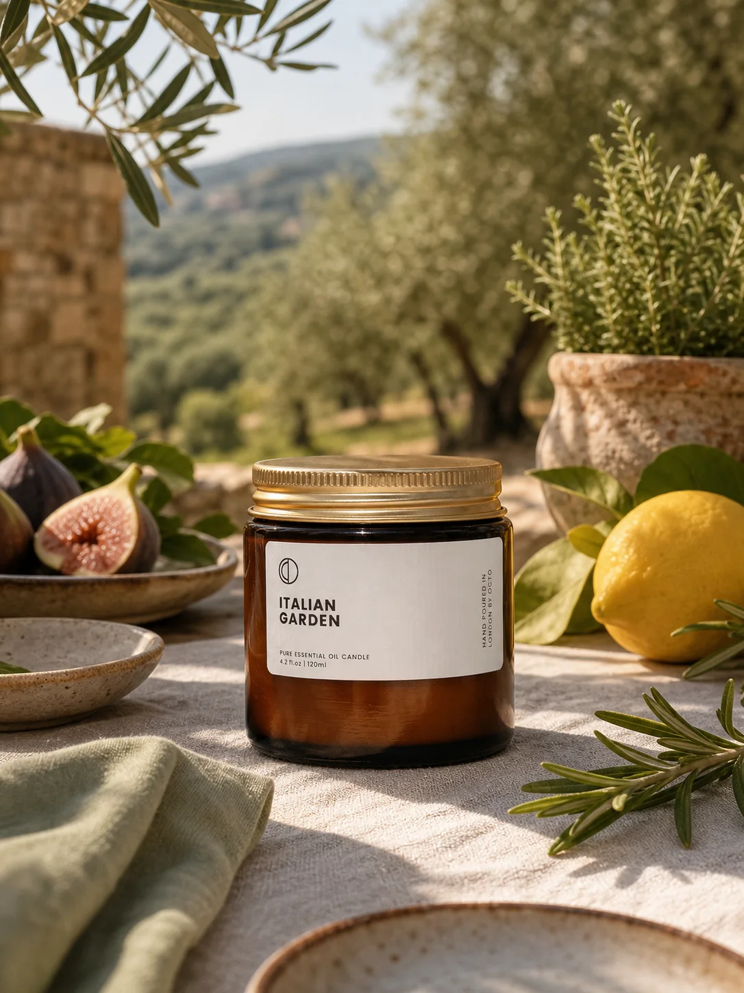 Italian Garden candle staged on an olive grove breakfast table